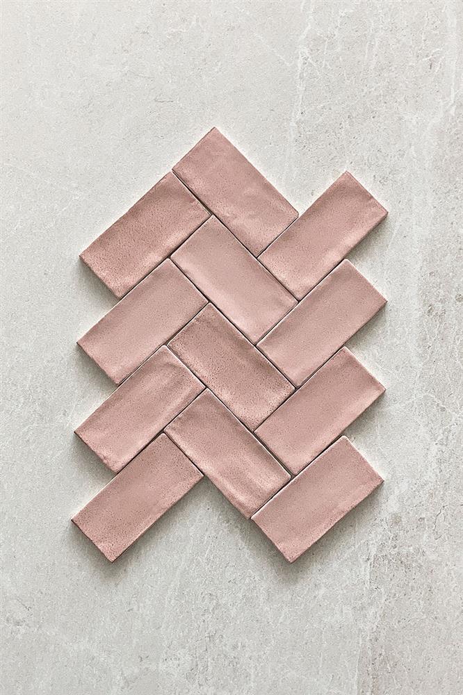 An example of uncoloured metro tiles laid in a herringbone pattern